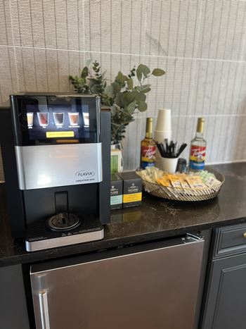 A coffee maker on a counter in a kitchen